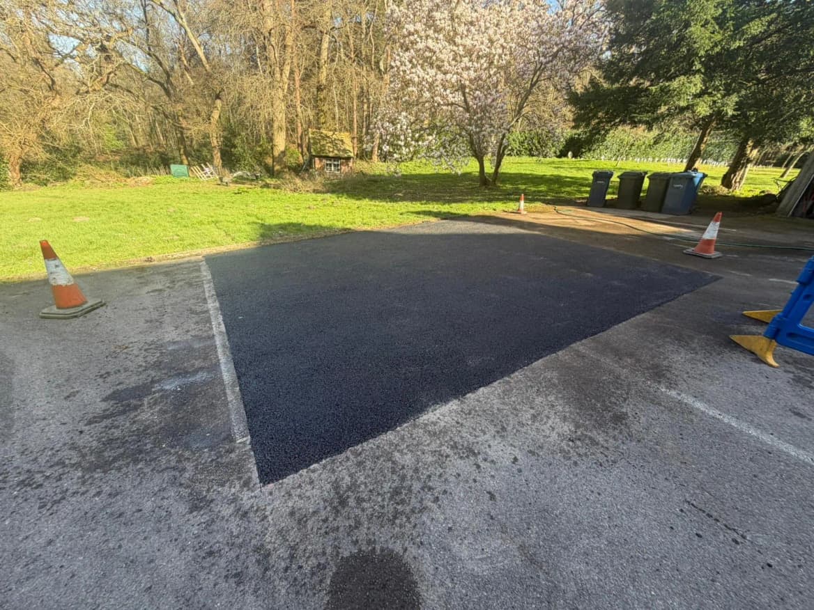 A fresh tarmac repair patched cleanly into an existing surface.