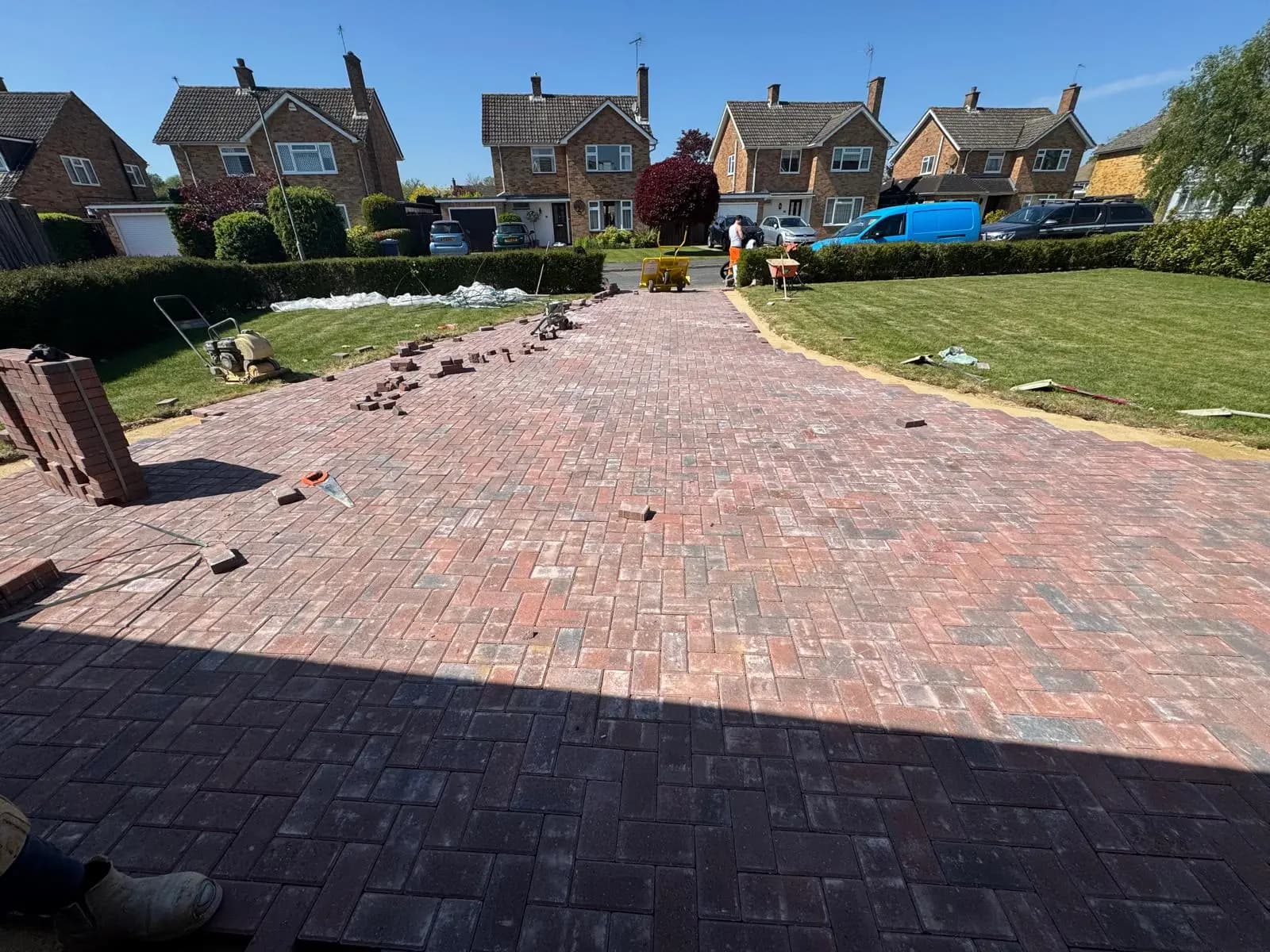 Newly laid brindle block paving driveway nearing completion in Cranleigh