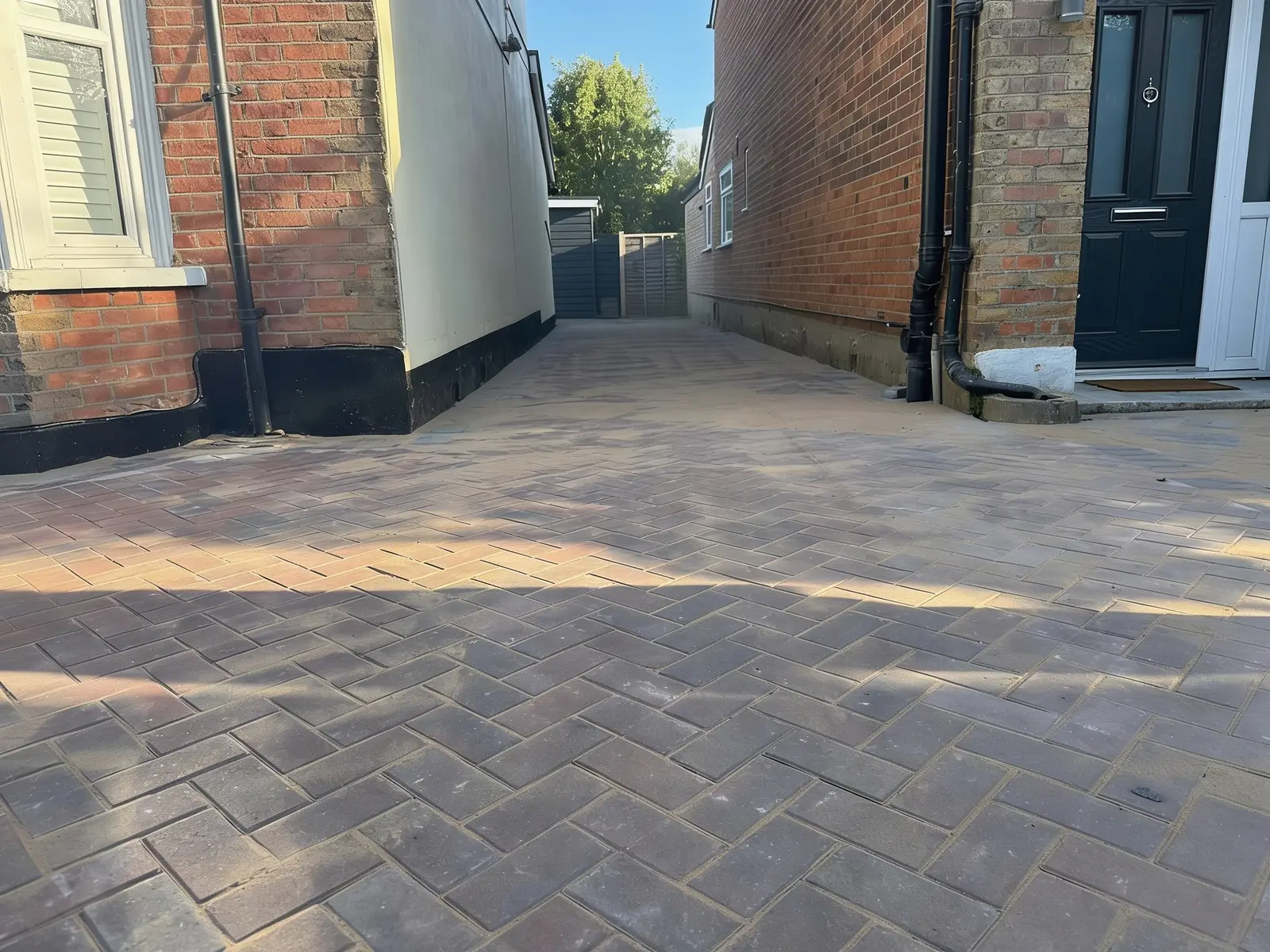 Finished brindle block paving driveway laid in a herringbone pattern
