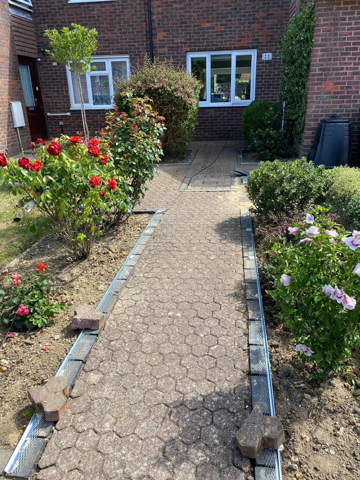 Worn block-paved front path before resurfacing