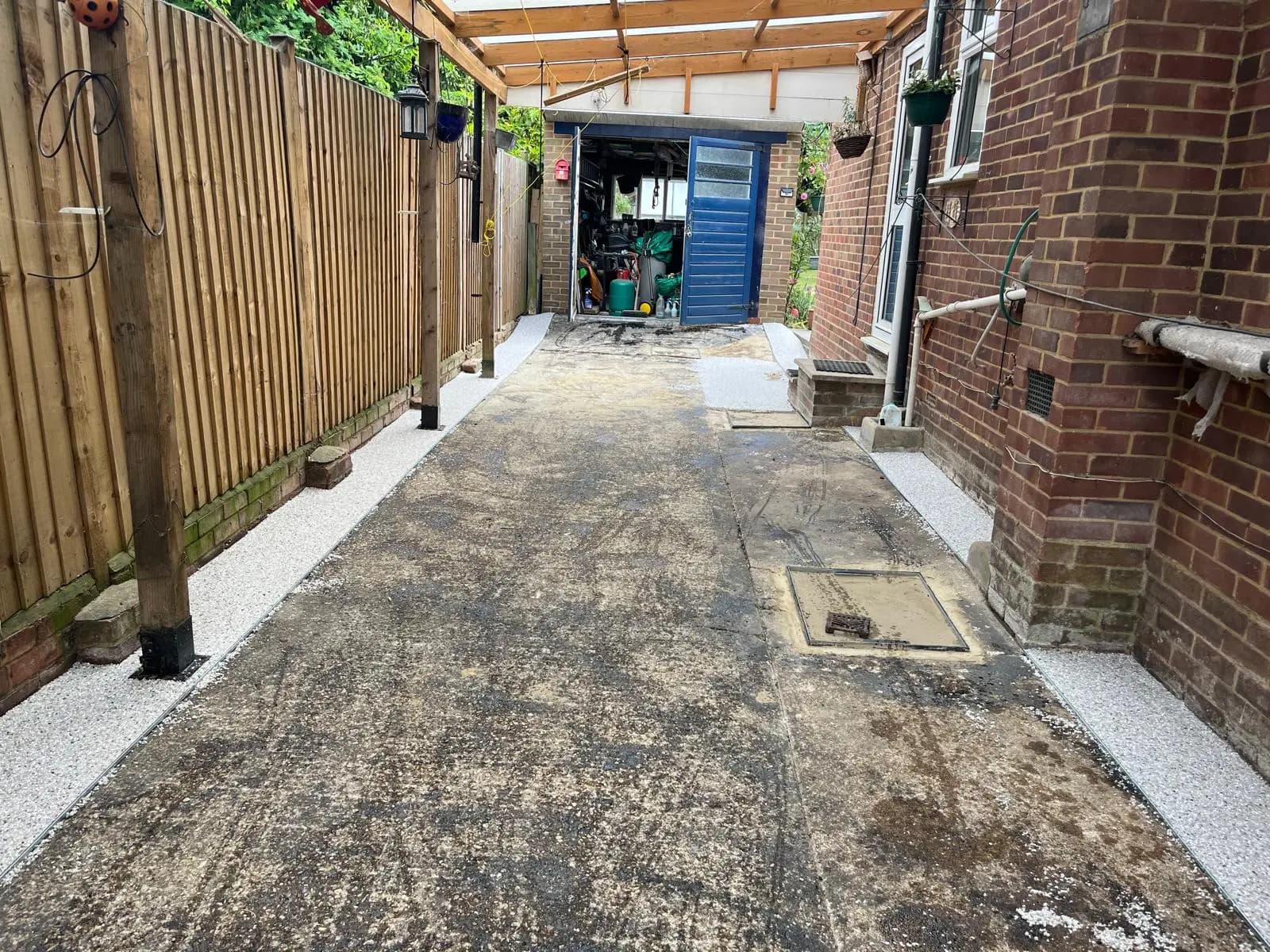 Old, stained concrete side access before resurfacing